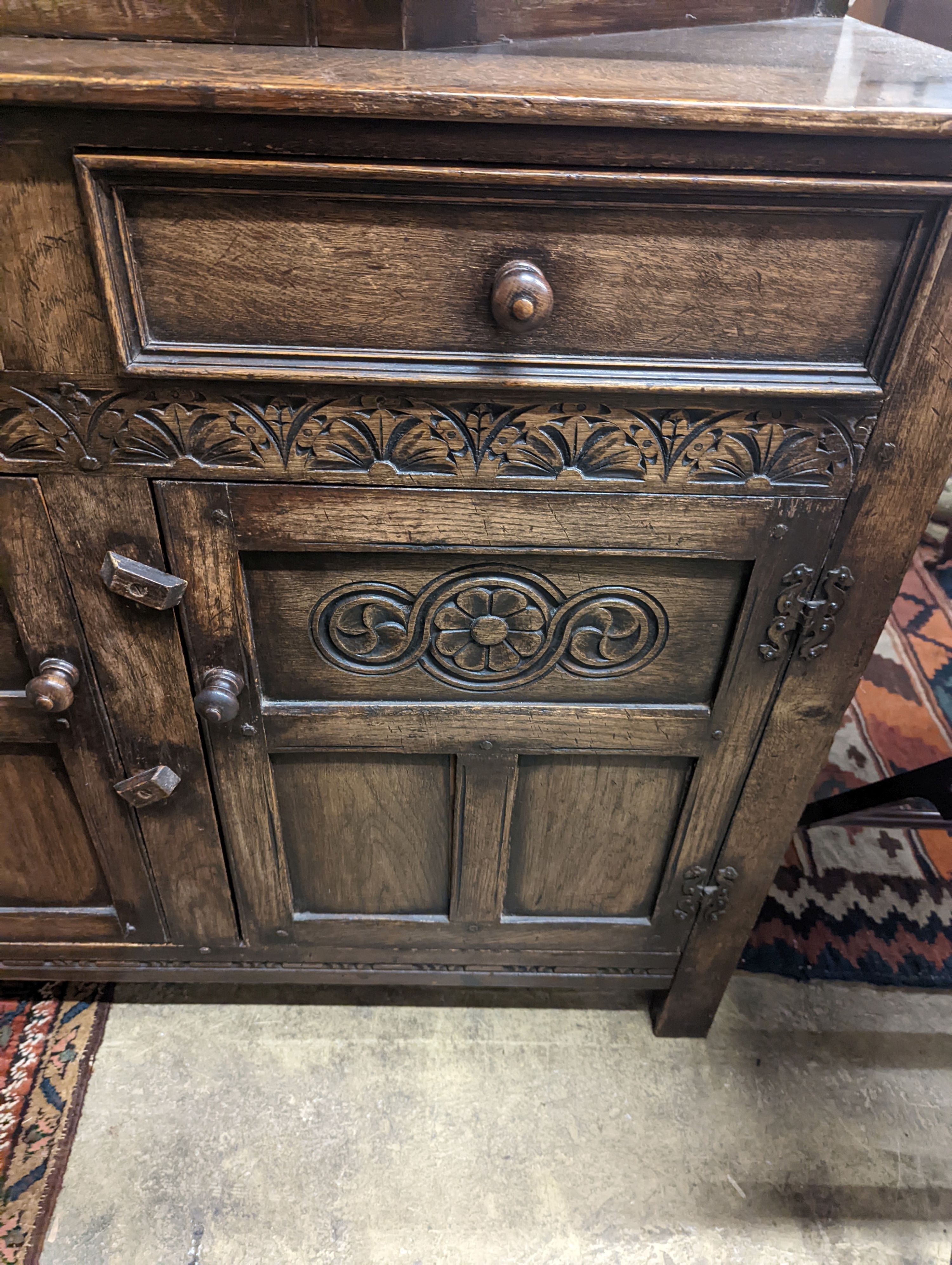 An 18th century style oak court cupboard, length 108cm, depth 43cm, height 128cm